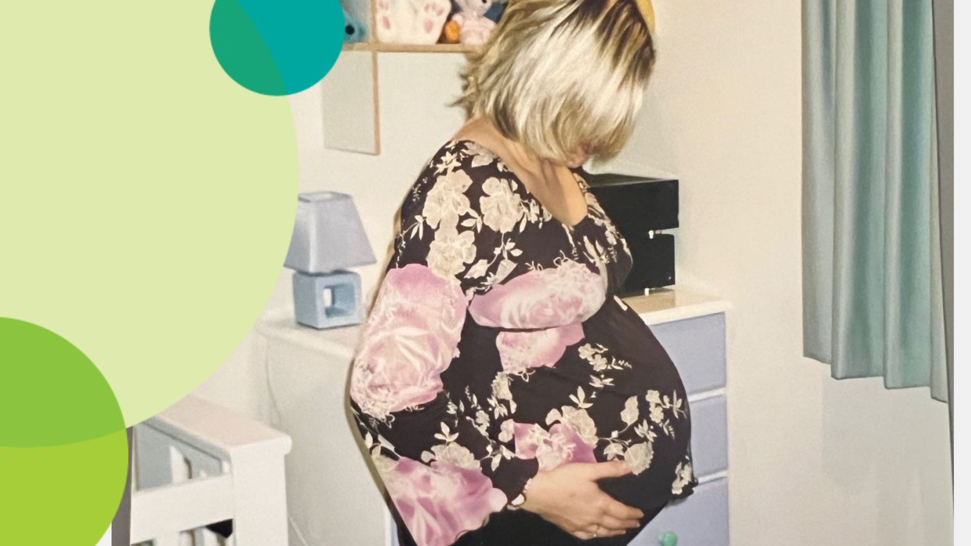 Natalie touches her pregnant belly